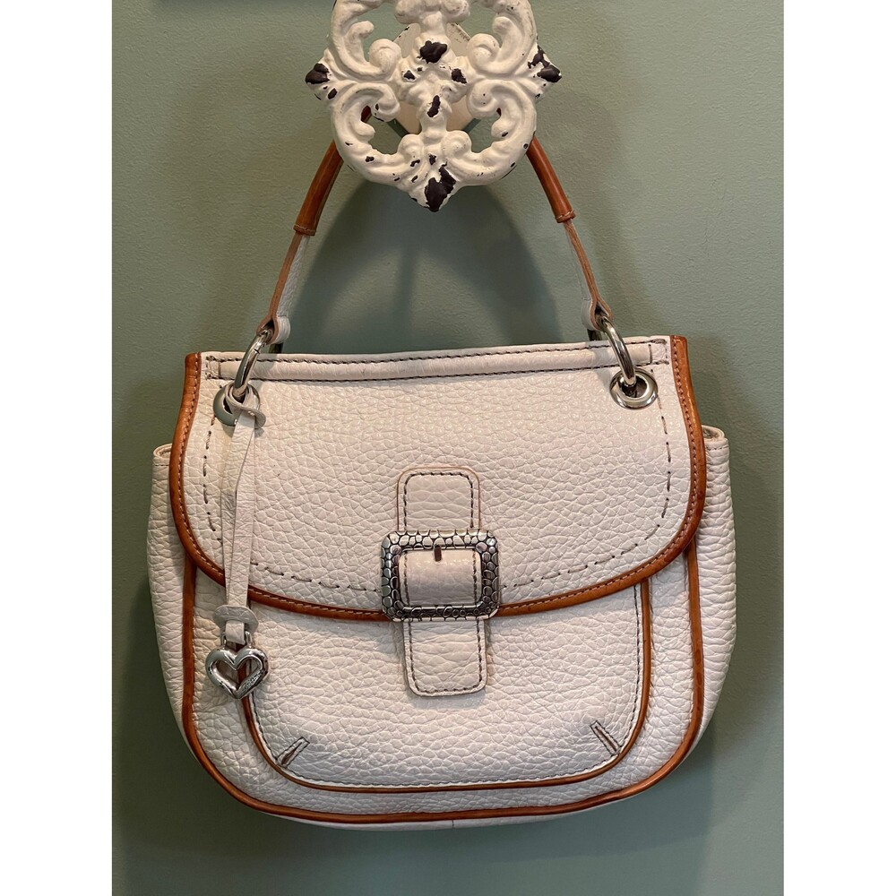 Like New Genuine Brighton ivory handbag made with embossed leather.